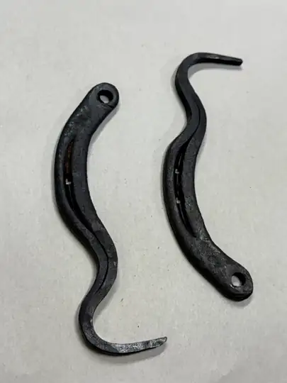 Two hand-forged hoof picks